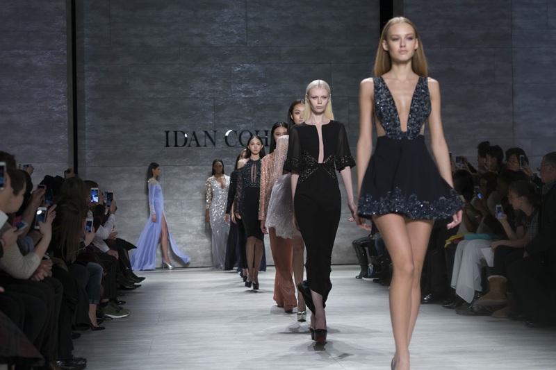 A catwalk model showcases fashion on the runway with confidence